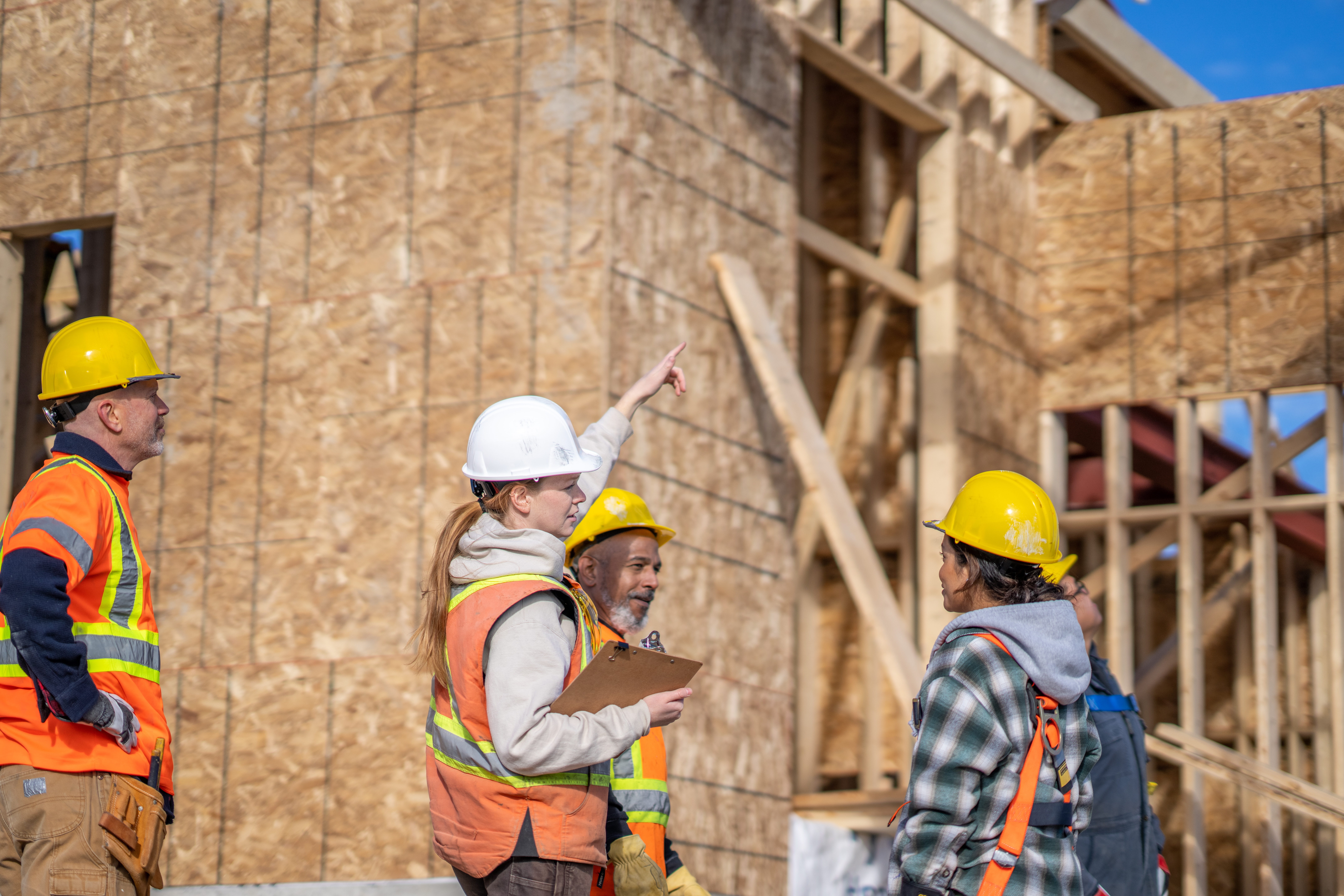 Construction team members meeting on site
